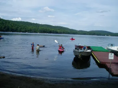 People kayaking to the annual corn roast