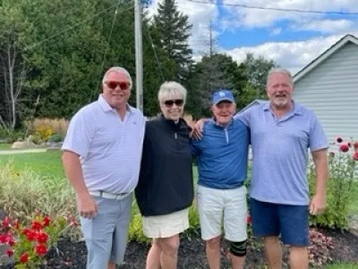 Team #1 made up of four golfers pose at Lakeside Golf Course.