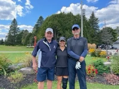 Team #5 made up of three golfers pose at the Lakeside Golf Course.