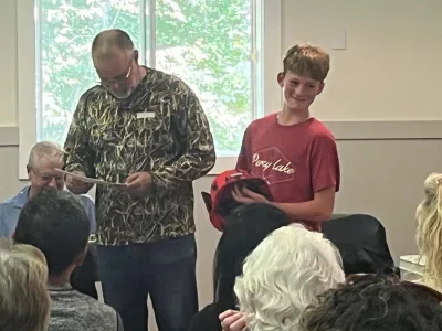 Cohen Elson accepts a second place trophy for the youth angler bass contest.