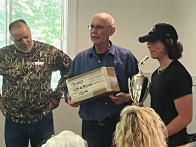 Julian Tilman accepts Bass 1st Place Trophy and MatCorpTrophy