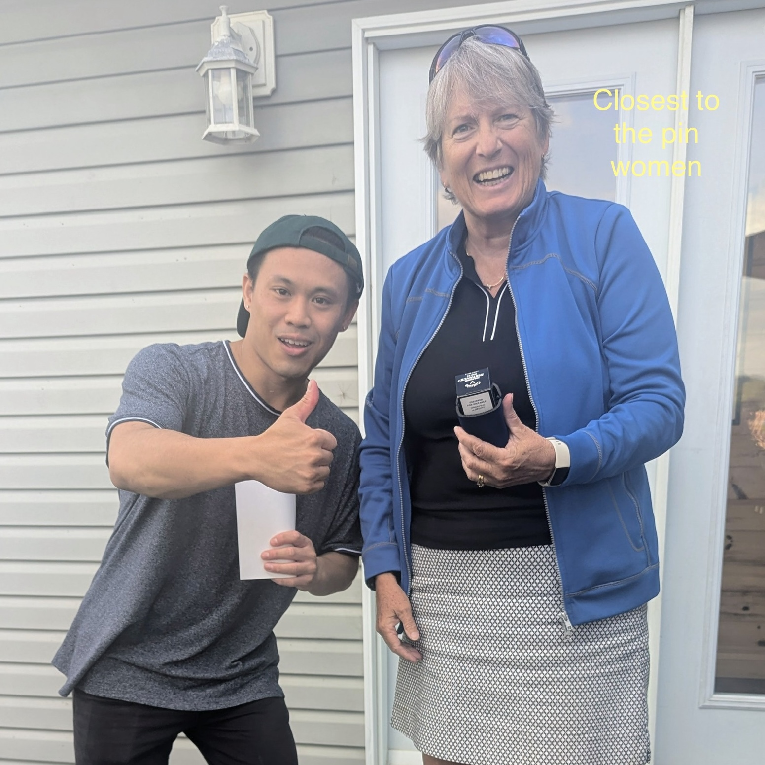 Diane accepts the closest to pin award.