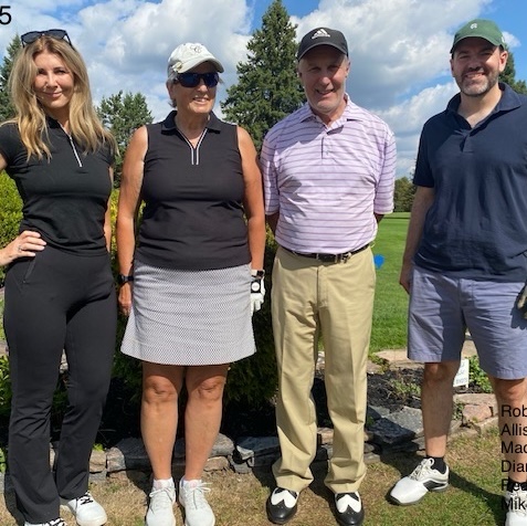 Four golfers that make up team 3 pose with clubs in hand.